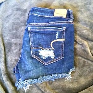 Distressed dark blue jean shorts
